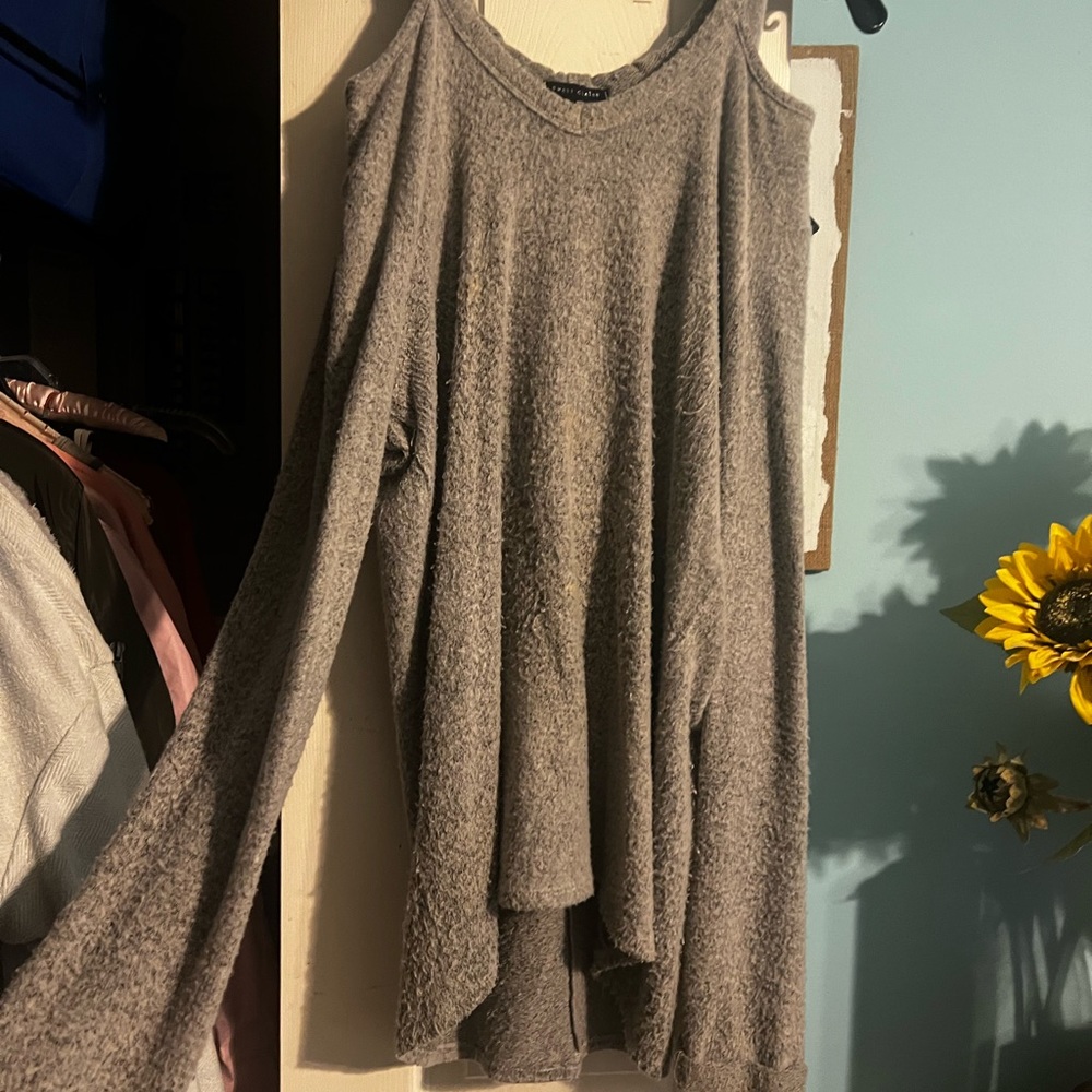 Long sweater-top with shoulders cut out; has a hoodie. Size M